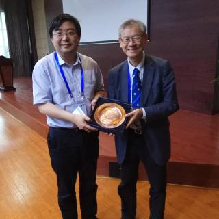 Prof. Gaoxiang of Zhejiang University present souvenirs to Prof. Any Hor